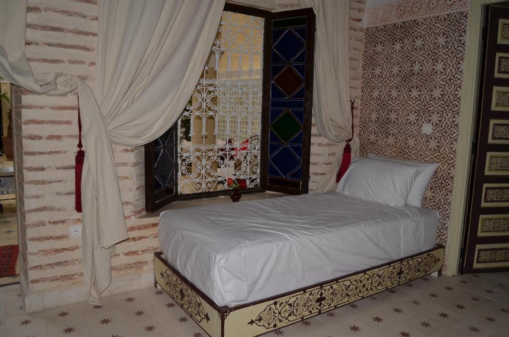 Tempat tidur dalam kamar di Riad Dar Hamid Hotel & Spa