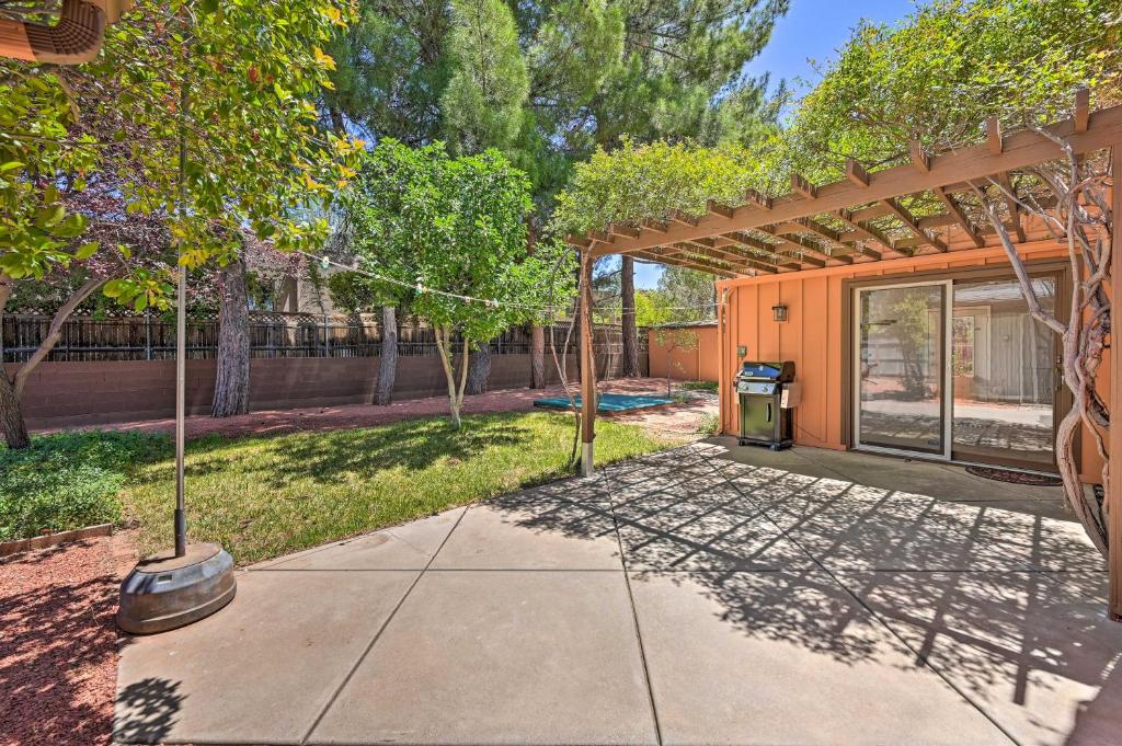 a walkway in front of a house with trees at 4 Mi to Main Street Spacious Sedona Home in Sedona