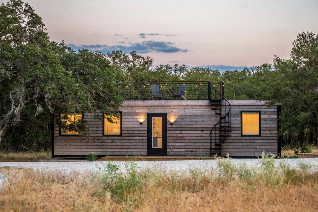 a tiny house on the side of a road at New! The Texas Longhorn-Luxury Container Home in Fredericksburg
