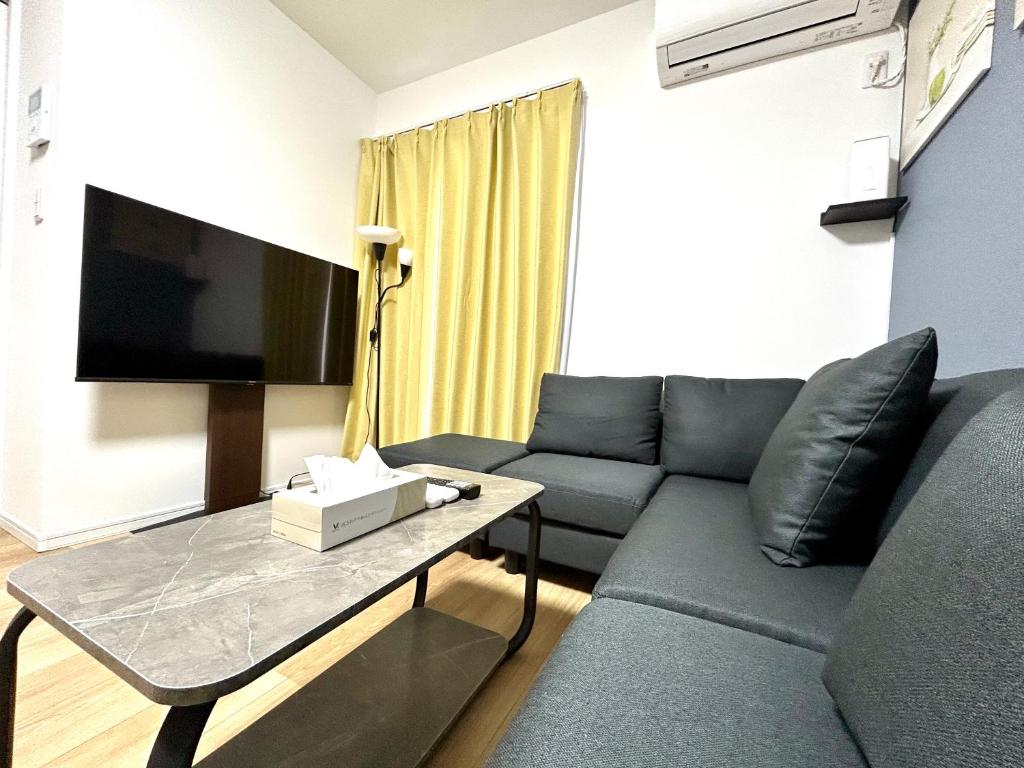 Cozy HOUSE 北新宿 TV 또는 엔터테인먼트 센터