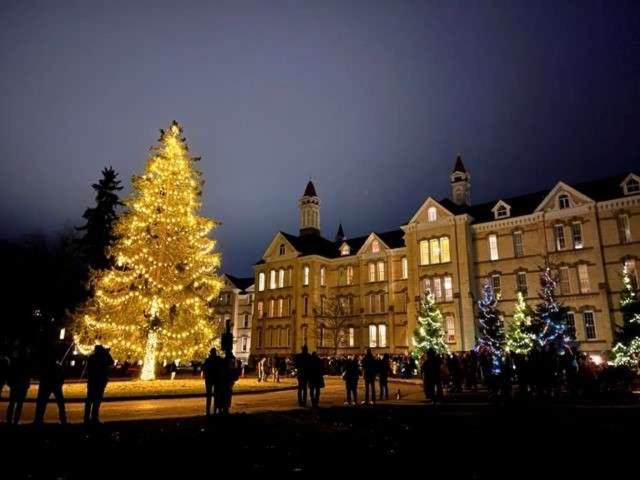 a christmas tree in front of a large building at Condo on State Hospital Grounds! in Traverse City