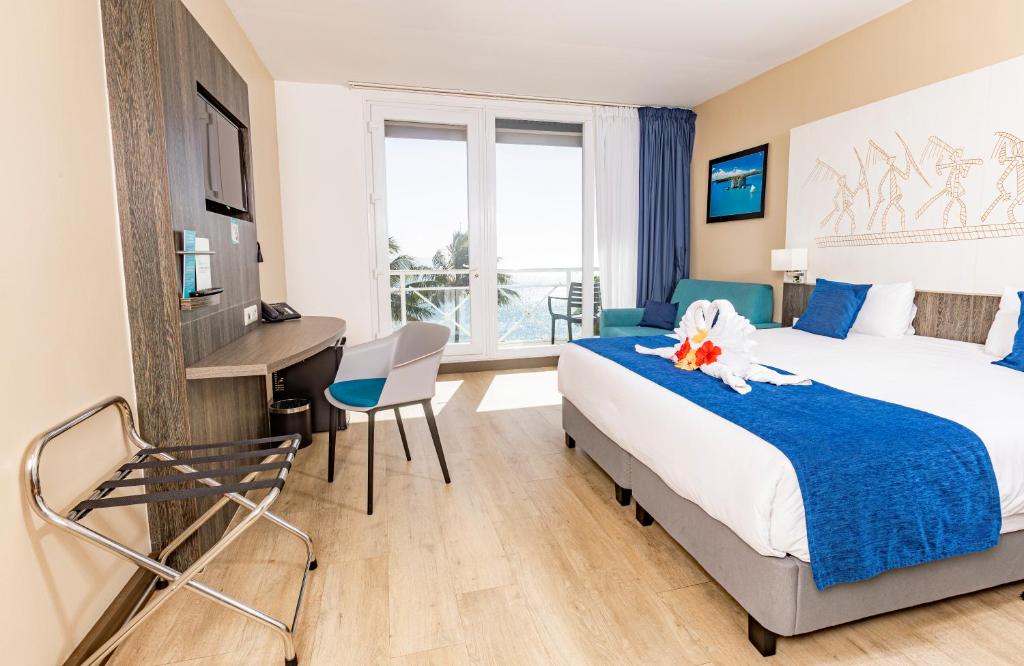 Ένα ή περισσότερα κρεβάτια σε δωμάτιο στο Hotel Beaurivage