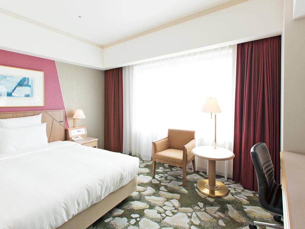 Uma cama ou camas num quarto em Surfeel Hotel Wakkanai