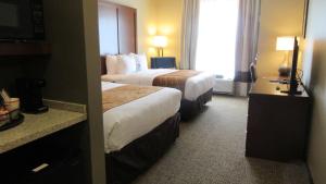 A bed or beds in a room at Comfort Inn & Suites Boise Airport