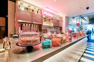 a store with many glass vases on a counter at Kixby in New York