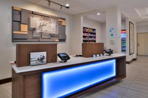 a pharmacy lobby with a large blue display at Holiday Inn Express Hotel & Suites Cincinnati - Mason by IHG in Mason +37 photos