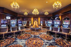 a casino with a bunch of slot machines at Excalibur in Las Vegas