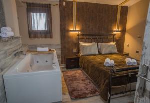 En eller flere senger på et rom på ΒΙΛΛΑ ΤΟ ΠΕΤΡΙΝΟ stone bild villa full equipment + 37 bilder