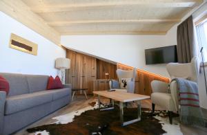 A seating area at Passo Sella Dolomiti Mountain Resort