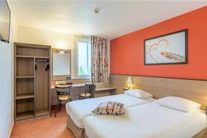Кровать или кровати в номере Ace Hôtel Paris Roissy
