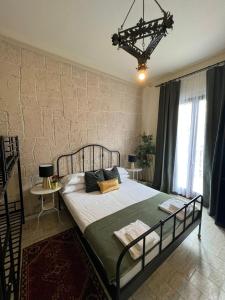 a bedroom with a large bed in front of a brick wall at Ambra Boutique Hotel in Milan +18 photos