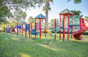 a row of colorful playground equipment in a park at The Palms of Destin-2116 in Destin