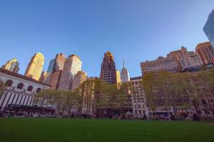 a park in the middle of a city with tall buildings at Iroquois New York Times Square in New York