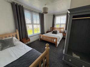 Voodi või voodid majutusasutuse The Queens Hotel Harlech toas