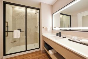 a bathroom with a sink and a shower at Hotel Effie Sandestin Resort, Autograph Collection in Destin