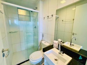 a bathroom with a shower and a toilet and a sink at Fortaleza Sul Flats Service in Fortaleza +20 photos