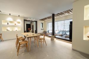 a kitchen and dining room with a table and chairs at Boro Hanok hostel in Myeongdong in Seoul +37 photos