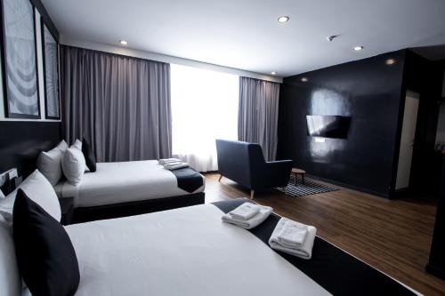 Katil atau katil-katil dalam bilik di Bloommaze Boutique Hotel Puchong