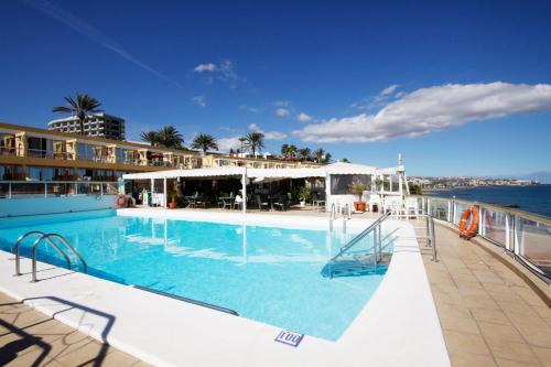 a large swimming pool on a cruise ship at Atlantic Beach Club in Playa del Ingles