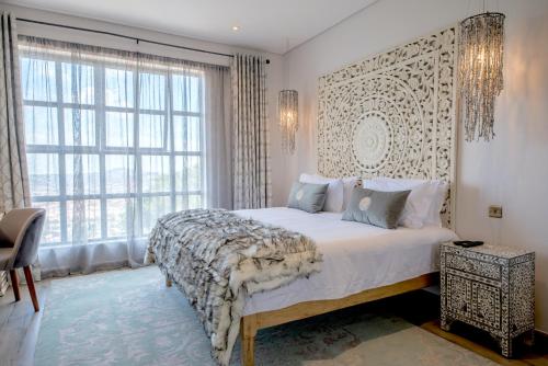 A bed or beds in a room at Latitude 0 Degrees