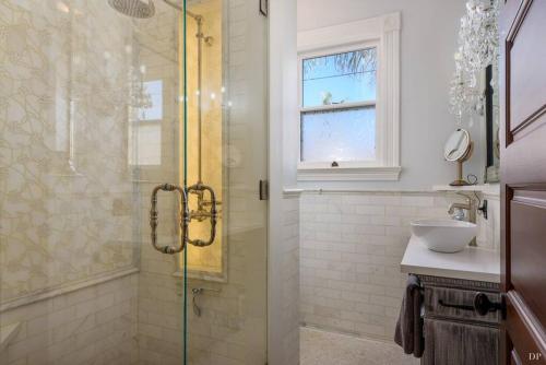 a bathroom with a shower and a sink at Upscale Downtown Home Walk to Beach shops Bars 2 in Santa Barbara