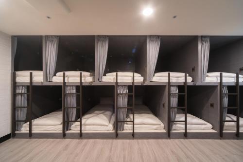 Un pat sau paturi într-o cameră la Hotel Fun - Linsen